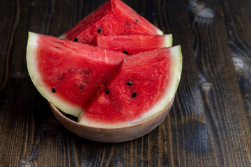 Sliced red and ripe watermelon on the table