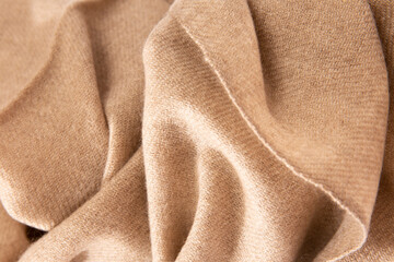 Natural wool beige fabric. Cashmere, wool. Texture of natural wool fabric. Knitwear.
