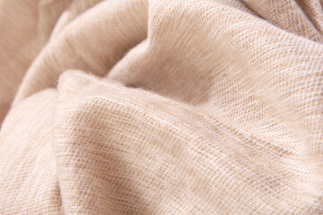 Natural wool cream colored fabric. Cashmere, wool. Texture of natural wool fabric. Knitwear.