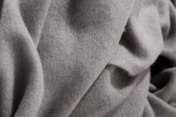 Natural wool grey colored fabric. Cashmere, wool. Texture of natural wool fabric. Knitwear.