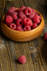 Harvested red ripe raspberries in the kitchen