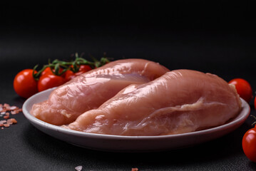 Pieces of raw chicken or turkey fillet with salt, spices and herbs