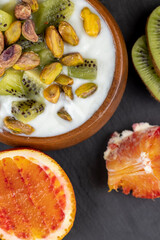 delicious green yogurt with fruit and berry flavor and pistachios