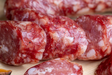 Dried veal sausage during slicing