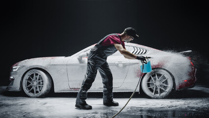 Advertising Style Footage of a Professional Car Wash Specialist Spraying Car Shampoo Foam to...