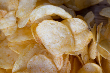 thin potato chips with spices, close up