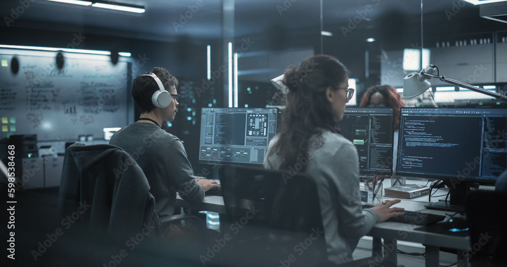 Fototapete Team of Talented Young Professionals Working in a Technological Research and Development Agency. Computer Screens with Software Code and Technical Neural Network Diagrams