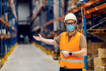 A friendly delivery center worker is welcoming visitors in facility.