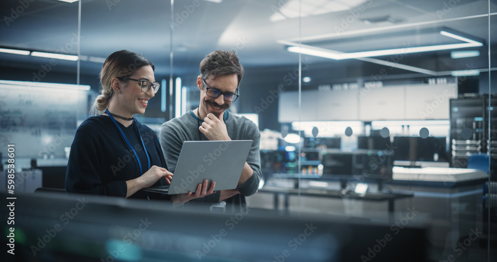 Aufkleber Portrait of Two Creative Young Female and Male Engineers Using Laptop Computer to Analyze and Discuss How to Proceed with the Artificial Intelligence Software. Standing in High Tech Research Office