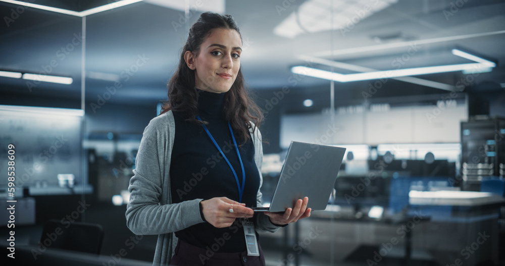 Poster Portrait of a Happy Smiling Female, Using Laptop Computer, Looking at Camera and Smiling. Empowered Information Technology Specialist, Software Engineer or Developer