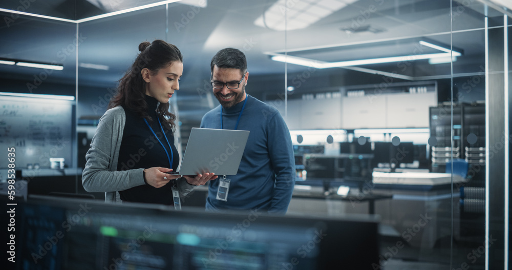 Aufkleber Portrait of Two Happy Female and Male Engineers Using Laptop Computer to Analyze and Discuss How to Proceed with the Artificial Intelligence Software. Casually Chatting in High Tech Research Office