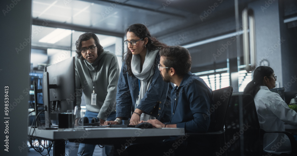 Poster Team of Three Talented Young Software Engineers Use Computer to Discuss a Technological Project in Modern Industrial Office. Group of Male and Female Scientists Work in Research and Development Center