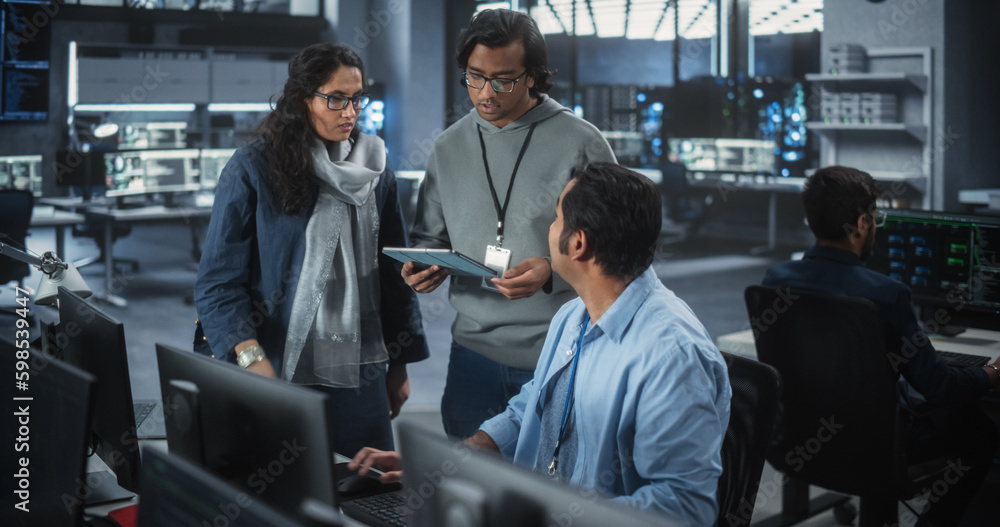 Leinwandbilder Team of Three Young Indian Software Engineers Use Computer to Discuss a Technological Project in Modern Industrial Office. Male and Female Scientists High Five and Celebrate Successful Test Result