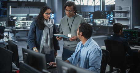Team of Three Young Indian Software Engineers Use Computer to Discuss a Technological Project in...