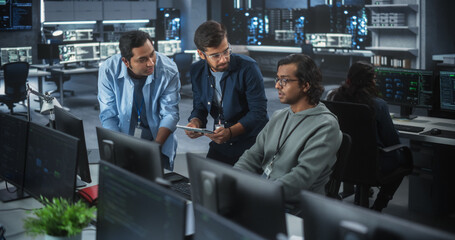 Team of Three Multiethnic Diverse Software Developers Talk, Discuss and Collaborate on an AI Project. Empowered Young Indian Specialists Work on Digital E-Commerce Startup Business