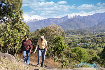 Senior Couple Enjoying Walk on mountain.