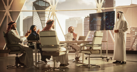 Muslim Businessman Holds Meeting Presentation for Diverse Business Partners. Managers Appreciate...