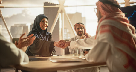 Muslim Businesspeople Closing a Business Deal at a Corporate Modern Office. Female and Male...