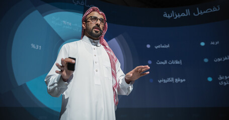 Saudi Businessman Making a Presentation on Stage During a Middle Eastern Business Conference....
