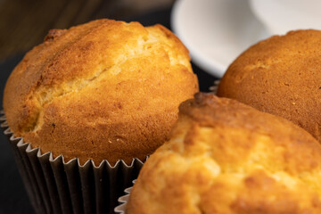 Soft and fresh fragrant wheat cupcake on a black stone