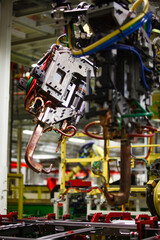 Fototapeta premium Head of robot manipulator with electric 4welding tool. Сar production plant