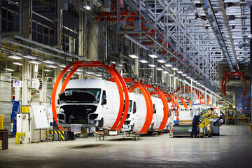 Сar production plant. Buses on assembling line.