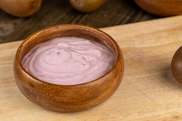 fresh yogurt with berries and fruits with red oranges
