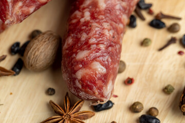 Dried veal sausage during slicing