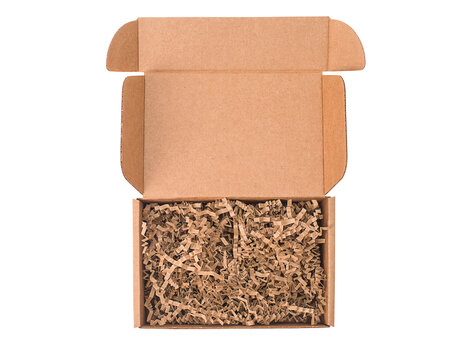 Mockup. Open cardboard box with paper filling isolated on white background top view.