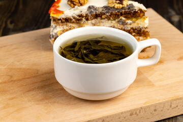 a cut piece of multi-layered honey cake with creamy filling