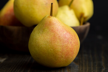 harvested sweet ripe pear in drops of water