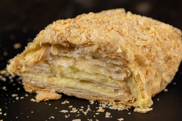 delicious piece of cake with puff pastry and sweet cream