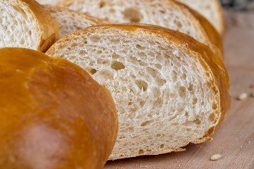 Wheat baguette on a wooden cutting board