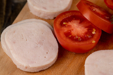 Sliced ripe red tomato on the table