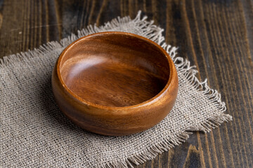 an old empty wooden bowl on the table