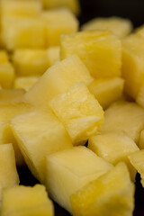 sliced ripe yellow pineapple, a large number of pieces