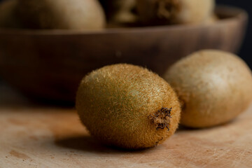 A group of whole green kiwi fruits not peeled