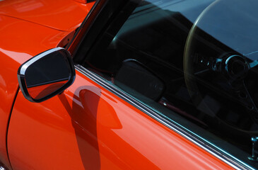 Sideview mirror of an old vintage car, conceptual vintage background