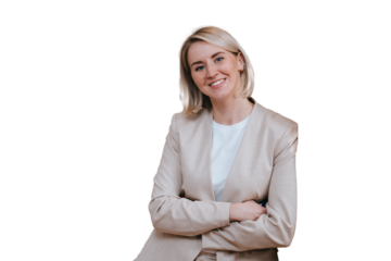 Blonde caucasian young woman in beige suit standing at office looks at camera toothy smiles against transparent background. Cheerful American business woman satisfied by career. Successful people.