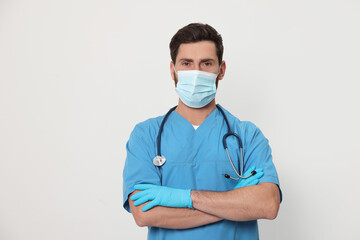 Nurse with medical mask and stethoscope on white background