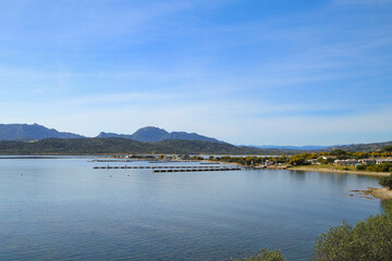 Fototapeta na wymiar View at the Marina Cala dei Sardi Gulf of Cugnana (Golfo di Cugnana) Sardinia