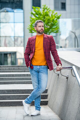 Obraz premium photo of standing man in menswear of jacket. man in menswear outdoor.
