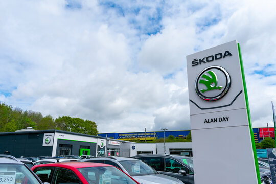 London. UK- 05.01.2023. The name sign and logo of Skoda Auto on the forecourt of a car dealer with cars on display for sale.