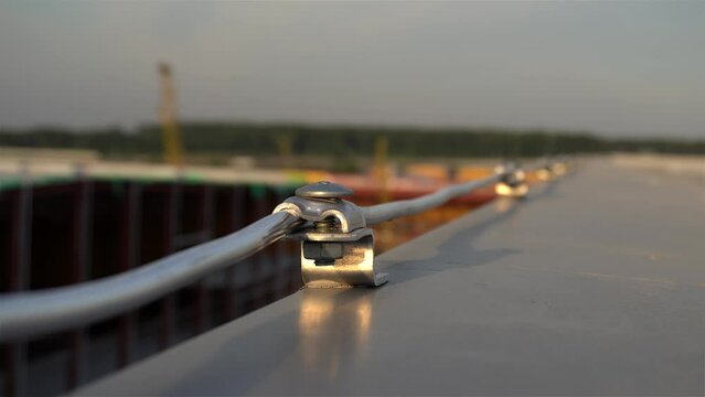Down Conductors Circuit as the part of the Lightning Protection System on an  industrial building roof.