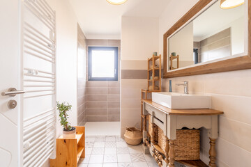 Home bathroom, bright new bathroom interior with tiled glass shower, vanity cabinet, interior designed white with straw minbres