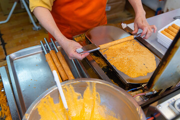 Making egg roll in the street market