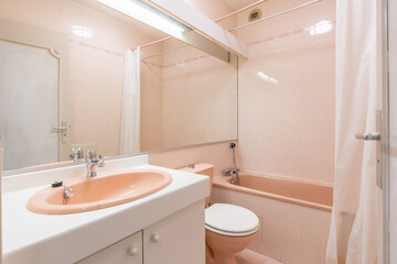 Home bathroom, bright new bathroom interior with tiled glass shower, vanity cabinet, interior designed with white and pink