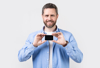 photo of happy man hold business credit. man show business credit isolated on studio