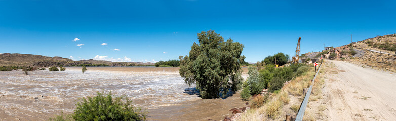 Boegoeberg Dam wall covered by flooded Orange River