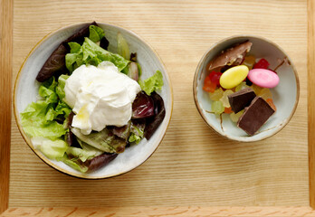 Bowls with small salad and yoghurt and sweets Blood sugar management for diabetes